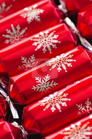 Christmas crackers Christmas crackers stock photo, Closeup of many red Christmas crackers in a row by Elena Elisseeva