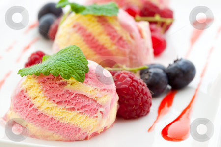 To use this stock image in your creative project, please select the size you need over to the right and click the "Add to Cart" button.
Your downloaded image will come with the Cutcaster watermark removed so don’t worry about the watermark you see on this page. Three scoops of raspberry ice cream with fresh fruit stock photo, Three scoops of raspberry ice cream with fresh raspberries, red currants and blue berries by Robert Anthony