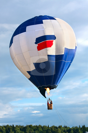 Hot air balloon Hot air balloon stock photo, Hot air balloon over a forest by Olga Lipatova