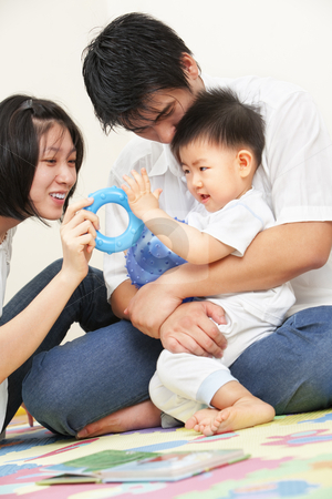 Asian young family spending time together Asian young family spending time together stock photo, Asian young family spending time together, playing with their little son by Rudyanto Wijaya