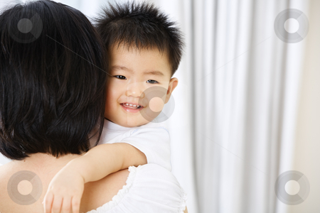 To use this stock image in your creative project, please select the size you need over to the right and click the "Add to Cart" button.
Your downloaded image will come with the Cutcaster watermark removed so don’t worry about the watermark you see on this page. Asian toddler on her mother hug stock photo, Asian toddler on her mother hug smiling to the side of camera, with copy space by Rudyanto Wijaya