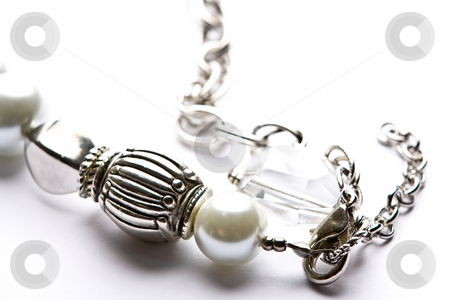 To use this stock image in your creative project, please select the size you need over to the right and click the "Add to Cart" button.
Your downloaded image will come with the Cutcaster watermark removed so don’t worry about the watermark you see on this page. Costume Juwelery stock photo, Silver designer costume jewelery in macro on white background by Adriaan Van den Berg