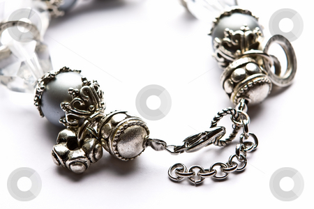Costume Juwelery Costume Juwelery stock photo, Silver designer costume jewelery in macro on white background by Adriaan Van den Berg