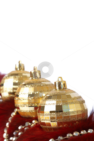 Golden Christmas baubles on fur Golden Christmas baubles on fur stock photo, Three golden Christmas baubles with gold beads on red fur isolated on white background with copy space. Shallow depth of field by Elena Weber (nee Talberg)