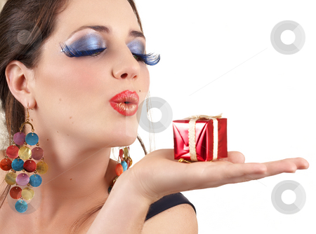 To use this stock image in your creative project, please select the size you need over to the right and click the "Add to Cart" button.
Your downloaded image will come with the Cutcaster watermark removed so don’t worry about the watermark you see on this page. Portrait of beautiful brunette woman stock photo, Portrait of a beautiful young brunette woman with dramatic glamour make-up and fashion earrings blowing a little gift box away by Elena Weber (nee Talberg)