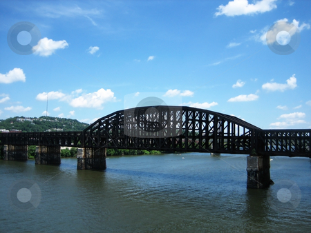 To use this stock image in your creative project, please select the size you need over to the right and click the "Add to Cart" button.
Your downloaded image will come with the Cutcaster watermark removed so don’t worry about the watermark you see on this page. Bridges stock photo, Stock pictures of a metal bridge in a city by Albert Lozano