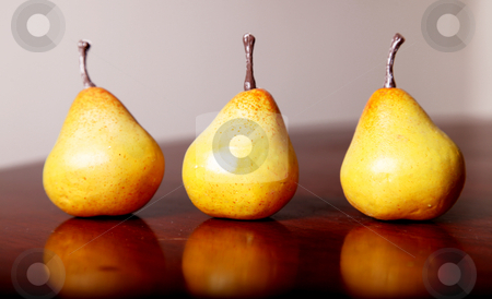 Fruit image Fruit image stock photo, Three yellow pears on wooden surface. fruits by Giuseppe Ramos