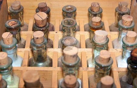 To use this stock image in your creative project, please select the size you need over to the right and click the "Add to Cart" button.
Your downloaded image will come with the Cutcaster watermark removed so don’t worry about the watermark you see on this page. Old medicine bottles stock photo, Rows of old medicine bottle with cork stoppers by Phil Morley