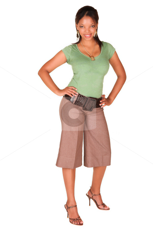 To use this stock image in your creative project, please select the size you need over to the right and click the "Add to Cart" button.
Your downloaded image will come with the Cutcaster watermark removed so don’t worry about the watermark you see on this page. African businesswoman isolated on white stock photo, A short smiling African businesswoman with brown trousers and a short sleeved green top and a faux leather belt. She has one arm in her side and is smiling at the viewer. Isolated on white. by Sean Nel