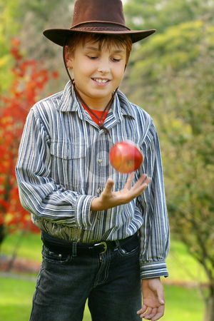 To use this stock image in your creative project, please select the size you need over to the right and click the "Add to Cart" button.
Your downloaded image will come with the Cutcaster watermark removed so don’t worry about the watermark you see on this page. Healthy Living Healthy Eating stock photo, A boy standing in pristine countryside is throwing up a fresh organic red apple. eg: green living, healthy lifestyle, organic produce, nature's best, Special Note: motion in apple and hand, 400iso by Leah-Anne Thompson