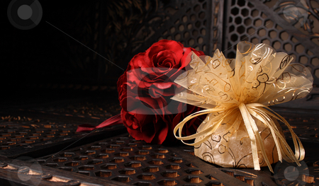 To use this stock image in your creative project, please select the size you need over to the right and click the "Add to Cart" button.
Your downloaded image will come with the Cutcaster watermark removed so don’t worry about the watermark you see on this page. Golden Favour stock photo, Wedding Favour gift back with a red rose by Vanessa Van Rensburg