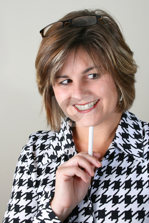 To use this stock image in your creative project, please select the size you need over to the right and click the "Add to Cart" button.
Your downloaded image will come with the Cutcaster watermark removed so don’t worry about the watermark you see on this page. Beautiful School Teacher stock photo, Friendly School Teacher holding white chalk under her chin by Vanessa Van Rensburg