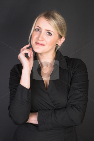 To use this stock image in your creative project, please select the size you need over to the right and click the "Add to Cart" button.
Your downloaded image will come with the Cutcaster watermark removed so don’t worry about the watermark you see on this page. Beautiful Businesswoman stock photo, Beautiful Businesswoman wearing a black top against a black background by Carla Booysen