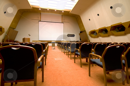 To use this stock image in your creative project, please select the size you need over to the right and click the "Add to Cart" button.
Your downloaded image will come with the Cutcaster watermark removed so don’t worry about the watermark you see on this page. Rows of seats stock photo, The prespective of a conference or functional hall by Tito Wong