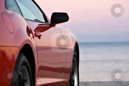 Modern Sports Car Modern Sports Car stock photo, A modern sports car parked at the beach around sunset. by Todd Arena