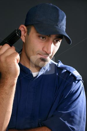 To use this stock image in your creative project, please select the size you need over to the right and click the "Add to Cart" button.
Your downloaded image will come with the Cutcaster watermark removed so don’t worry about the watermark you see on this page. Security Guard stock photo, Security guard in blue uniform with gun. by Leah-Anne Thompson