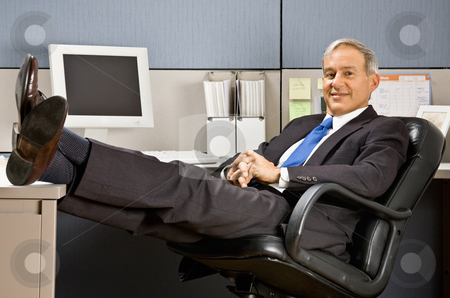 To use this stock image in your creative project, please select the size you need over to the right and click the "Add to Cart" button.
Your downloaded image will come with the Cutcaster watermark removed so don’t worry about the watermark you see on this page. Businessman with feet up at desk stock photo, Businessman with feet up at desk by Jonathan Ross