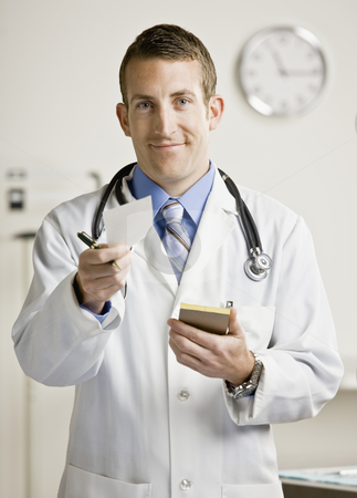 To use this stock image in your creative project, please select the size you need over to the right and click the "Add to Cart" button.
Your downloaded image will come with the Cutcaster watermark removed so don’t worry about the watermark you see on this page. Young Male Doctor stock photo, Young male doctor writing prescription. Vertically framed shot. by Jonathan Ross