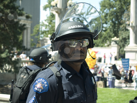 To use this stock image in your creative project, please select the size you need over to the right and click the "Add to Cart" button.
Your downloaded image will come with the Cutcaster watermark removed so don’t worry about the watermark you see on this page. Police man stock photo, Police in riot gear watch over crowds by Cora Reed