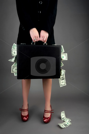 To use this stock image in your creative project, please select the size you need over to the right and click the "Add to Cart" button.
Your downloaded image will come with the Cutcaster watermark removed so don’t worry about the watermark you see on this page. Woman holding briefcase overflowing with money stock photo, Image of a woman, from shoulders down, holding a black briefcase overflowing with money by Greg Blomberg