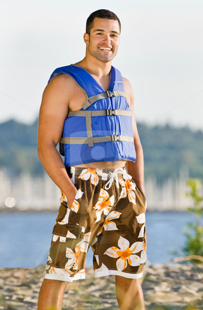 To use this stock image in your creative project, please select the size you need over to the right and click the "Add to Cart" button.
Your downloaded image will come with the Cutcaster watermark removed so don’t worry about the watermark you see on this page. Man wearing life jacket at beach stock photo, Man wearing life jacket at beach by Jonathan Ross