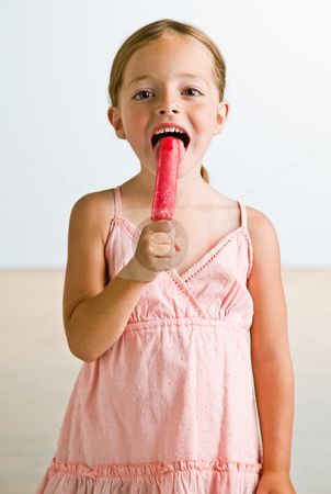 To use this stock image in your creative project, please select the size you need over to the right and click the "Add to Cart" button.
Your downloaded image will come with the Cutcaster watermark removed so don’t worry about the watermark you see on this page. Girl licking popsicle stock photo, Girl licking popsicle by Jonathan Ross