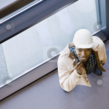 To use this stock image in your creative project, please select the size you need over to the right and click the "Add to Cart" button.
Your downloaded image will come with the Cutcaster watermark removed so don’t worry about the watermark you see on this page. Male Construction Worker stock photo, Male construction worker with two way radio. Square framed shot. by Jonathan Ross