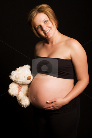 To use this stock image in your creative project, please select the size you need over to the right and click the "Add to Cart" button.
Your downloaded image will come with the Cutcaster watermark removed so don’t worry about the watermark you see on this page. Attractive pregnant young woman stock photo, Attractive and friendly pregnant young woman holding a teddy bear by Andre Van der Veen