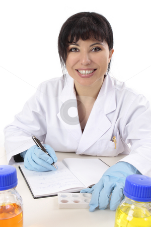 Smiling research scientist Smiling research scientist stock photo, Scientist at desk with research notes, spotting plate and laboratory chemicals. by Leah-Anne Thompson