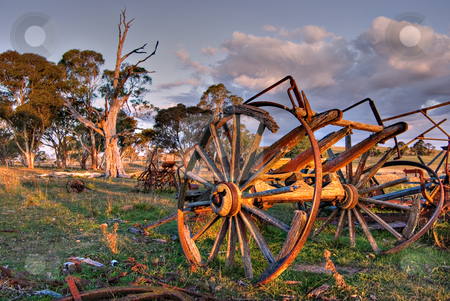 To use this stock image in your creative project, please select the size you need over to the right and click the "Add to Cart" button.
Your downloaded image will come with the Cutcaster watermark removed so don’t worry about the watermark you see on this page. Old cart stock photo, An old cart lays rotting on the farm at sunset by Phil Morley
