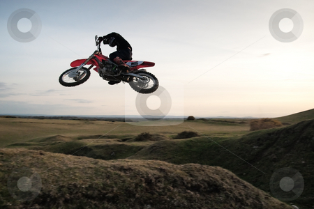 Motor cross rider Motor cross rider stock photo, Motor cross rider jumping through the air by Viv Van der Holst
