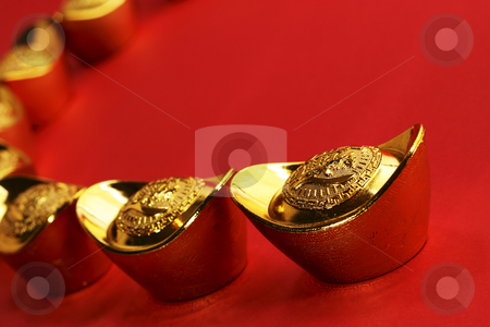 To use this stock image in your creative project, please select the size you need over to the right and click the "Add to Cart" button.
Your downloaded image will come with the Cutcaster watermark removed so don’t worry about the watermark you see on this page. Chinese gold ingots stock photo, A curved row of traditional chinese gold ingots on a red background by Adrin Shamsudin