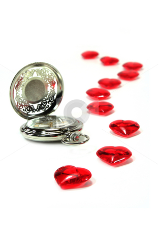 To use this stock image in your creative project, please select the size you need over to the right and click the "Add to Cart" button.
Your downloaded image will come with the Cutcaster watermark removed so don’t worry about the watermark you see on this page. Valentine's Day stock photo, Watch and red hearts on white background by Simone Voigt