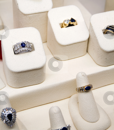 To use this stock image in your creative project, please select the size you need over to the right and click the "Add to Cart" button.
Your downloaded image will come with the Cutcaster watermark removed so don’t worry about the watermark you see on this page. Rings stock photo, Rings on sale at a jewlelry store by Bill Swiger