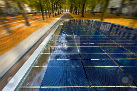 Solar powered tuc tuc Solar powered tuc tuc stock photo, Solar powered tuc tuc driving through a street at high speed by Corepics VOF