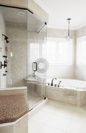 Upscale Bathroom Interior Upscale Bathroom Interior stock photo, Upscale neutral-toned bathroom with jacuzzi tub and shower. Vertical format. by Christopher Nuzzaco