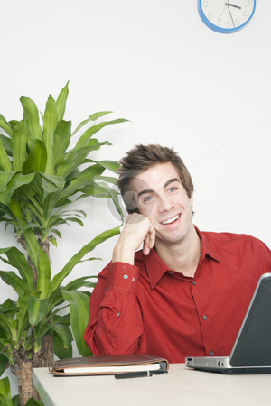 To use this stock image in your creative project, please select the size you need over to the right and click the "Add to Cart" button.
Your downloaded image will come with the Cutcaster watermark removed so don’t worry about the watermark you see on this page. Handsome Young Businessman Smiling stock photo, Handsome young businessman rests his head on his hand as he smiles. Vertical shot. by Paul Burns