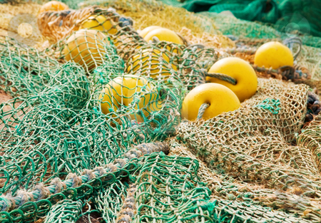 Deep Fishing Nets on Nets Coil Of Ropes And Yellow Floats Used By Fishermen For Deep Sea