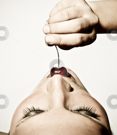To use this stock image in your creative project, please select the size you need over to the right and click the "Add to Cart" button.
Your downloaded image will come with the Cutcaster watermark removed so don’t worry about the watermark you see on this page. Closeup Of A Woman Tasting A Cherry stock photo, Closeup Upper View Of A Woman Sensually Tasting A Cherry by Nick Fingerhut