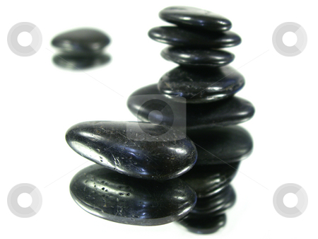 Reflected harmony 2 Reflected harmony 2 stock photo, Rocks carefully stacked on a mirror isolated on white with others out of focus in the back. shallow depth of field. focus on front single rock. by Christy Thompson