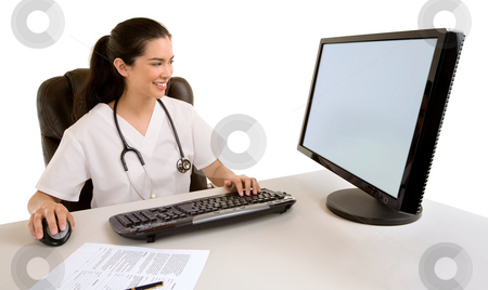 Nurse Sitting and Working at her Computer Nurse Sitting and Working at her Computer stock photo, A nurse is sitting and worrking at her computer. by Denis Pepin