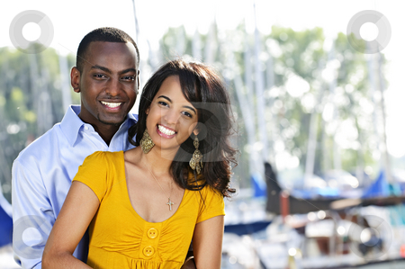 Happy couple hugging Happy couple hugging stock photo, Young romantic couple hugging and standing at harbor by Elena Elisseeva
