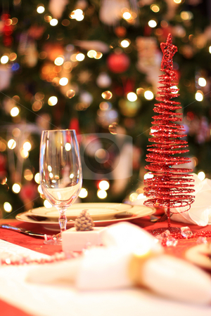 Christmas table Christmas table stock photo, Set christmas dinner table, decorated christmas tree in background, selective focus by Johann Helgason