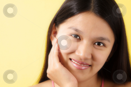 To use this stock image in your creative project, please select the size you need over to the right and click the "Add to Cart" button.
Your downloaded image will come with the Cutcaster watermark removed so don’t worry about the watermark you see on this page. Pretty woman stock photo, A portrait of a smiling pretty woman with yellow background by Suprijono Suharjoto