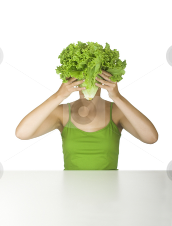 Lettuce head Lettuce head stock photo, Woman in green holding a lettuce in front of the face by ikostudio