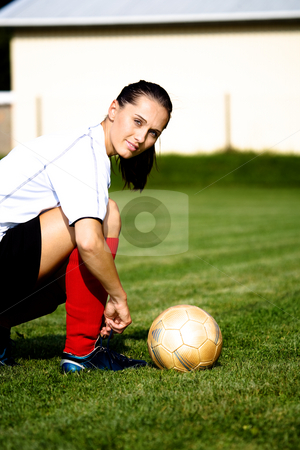 To use this stock image in your creative project, please select the size you need over to the right and click the "Add to Cart" button.
Your downloaded image will come with the Cutcaster watermark removed so don’t worry about the watermark you see on this page. Soccer girl stock photo, Female soccer player on the field by Val Thoermer