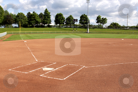 To use this stock image in your creative project, please select the size you need over to the right and click the "Add to Cart" button.
Your downloaded image will come with the Cutcaster watermark removed so don’t worry about the watermark you see on this page. Softball Diamond stock photo, A view of a softball diamond at dusk. by Chris Hill