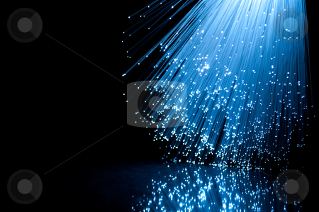 To use this stock image in your creative project, please select the size you need over to the right and click the "Add to Cart" button.
Your downloaded image will come with the Cutcaster watermark removed so don’t worry about the watermark you see on this page. Fibre optics and reflections stock photo, Close and low level angle capturing vibrant blue illuminated fibre optic light strands cascading downwards against a black background and reflecting onto a black glossy foreground. by Samantha Craddock