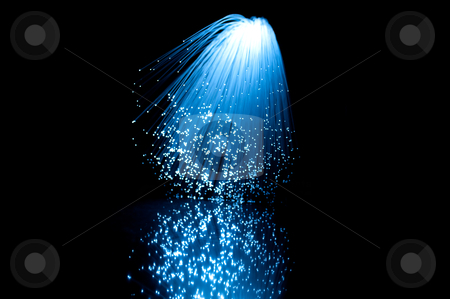 To use this stock image in your creative project, please select the size you need over to the right and click the "Add to Cart" button.
Your downloaded image will come with the Cutcaster watermark removed so don’t worry about the watermark you see on this page. Fibre optics and reflections stock photo, Close and low level angle capturing vibrant blue illuminated fibre optic light strands cascading downwards against a black background and reflecting onto a black glossy foreground. by Samantha Craddock