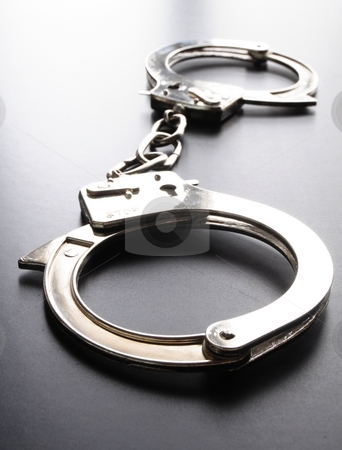 To use this stock image in your creative project, please select the size you need over to the right and click the "Add to Cart" button.
Your downloaded image will come with the Cutcaster watermark removed so don’t worry about the watermark you see on this page. Handcuffs stock photo, Police handcuffs on black background showing law concept by Gunnar Pippel